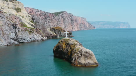 coastal rock with cross
