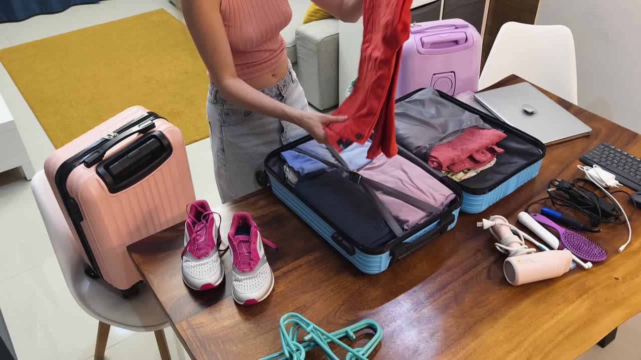 Woman packing suitcase for travel