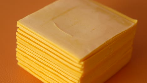 stack of yellow cheese slices