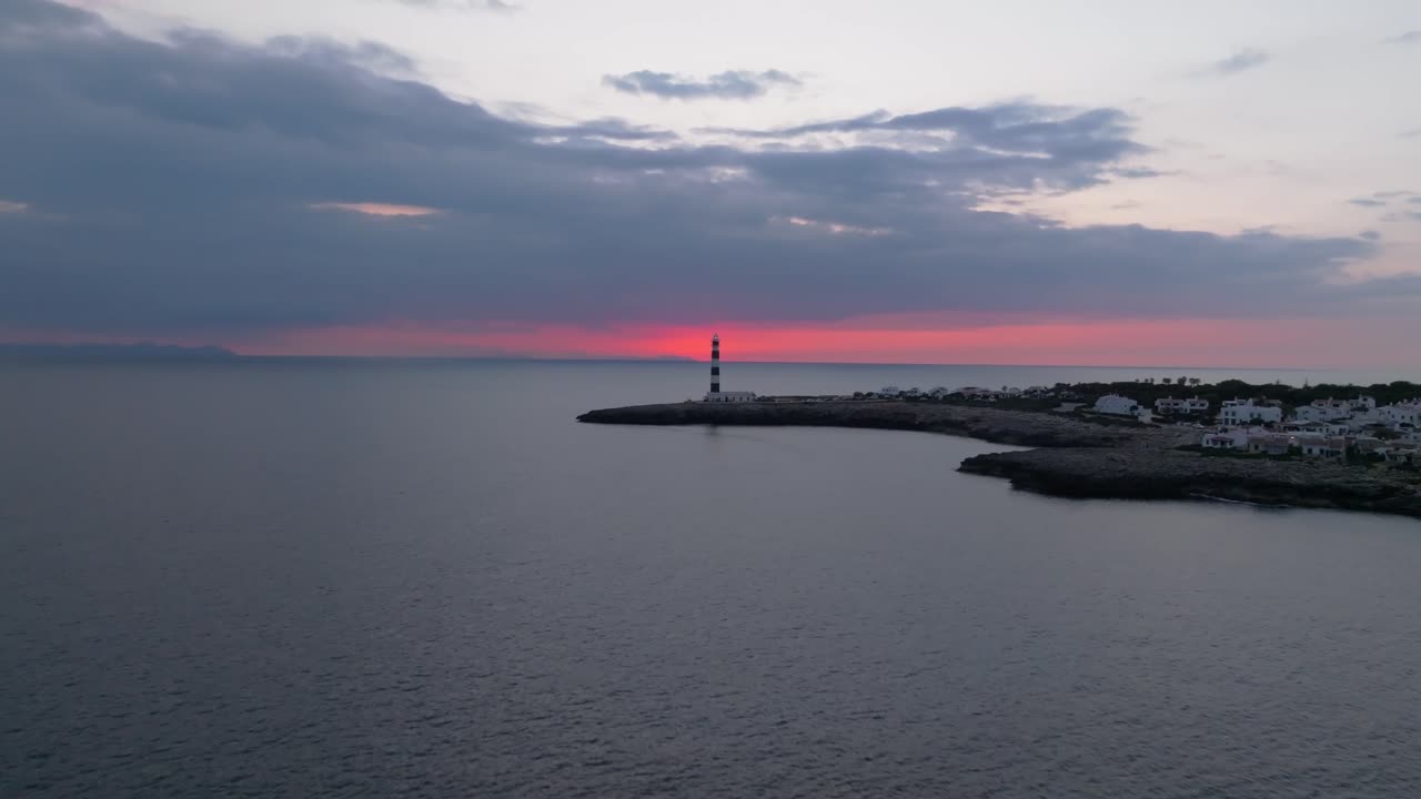 Panoramic Aerial Zoom into Dusk of Cap d’Artrutx Lighthouse and Menorca Coast, sunset skyline