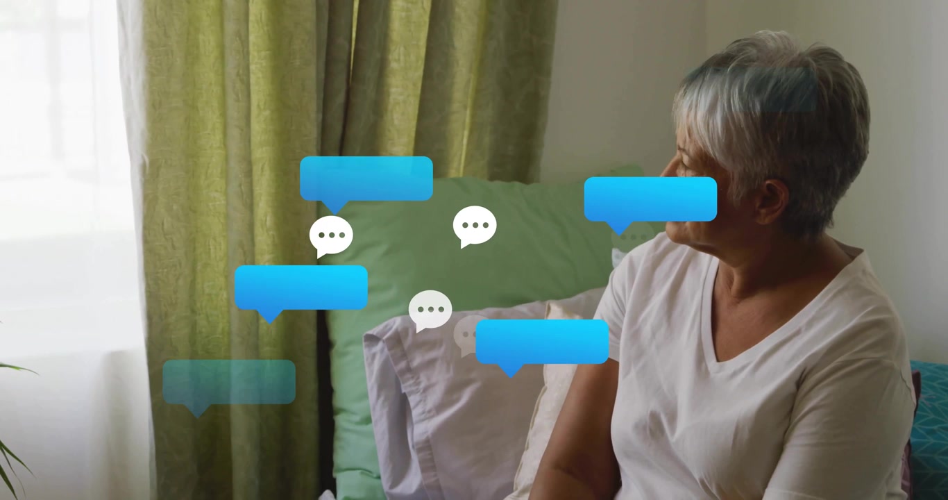 Donna anziana a letto che segue una bolla di chat blu in arrivo, avviando messaggi a cascata nella tecnologia