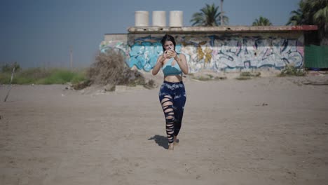 woman taking a picture on a beach