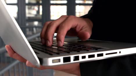 Businessmans-hands-typing-on-laptop-keyboard