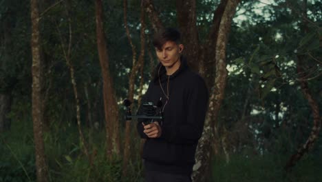 videographer filming in the forest