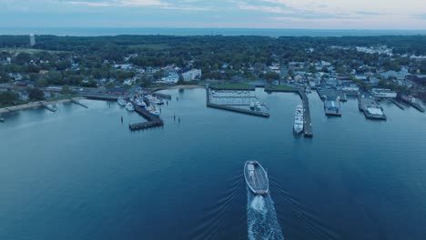 aerial drone shot of ferry approaching shelter island north fork long island new york before sunrise