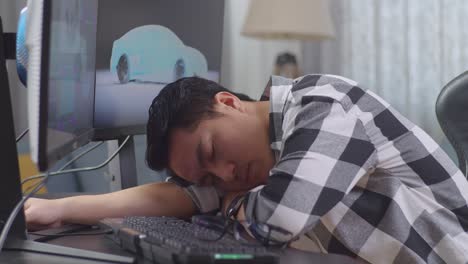 tired designer takes a nap at their desk