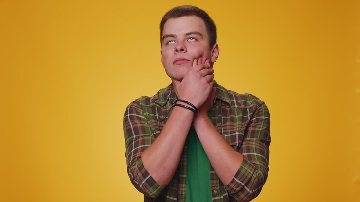 Man touching cheek suffering from toothache cavities or gingivitis waiting for dentist appointment