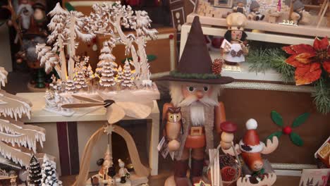 Wooden-Christmas-crafts-in-a-shop-window-in-Heidelberg,-germany-at-a-Festive-Christmas-market-in-Europe
