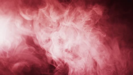 Video-of-red-clouds-of-smoke-moving-with-copy-space-on-black-background