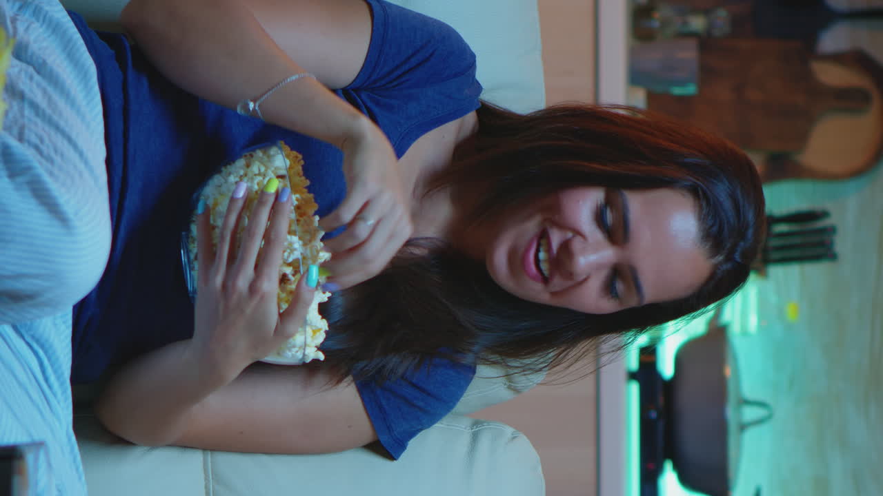 Vertical Video: Enjoying The Evening Watching Tv Series At Home