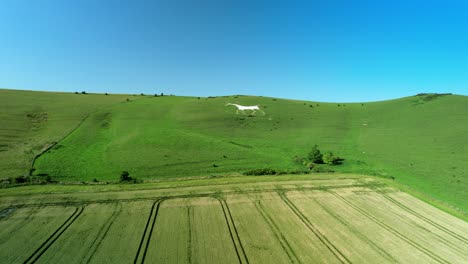 wiltshire historic white horse iconic chalk figure landmark aerial view low angle right from distant view