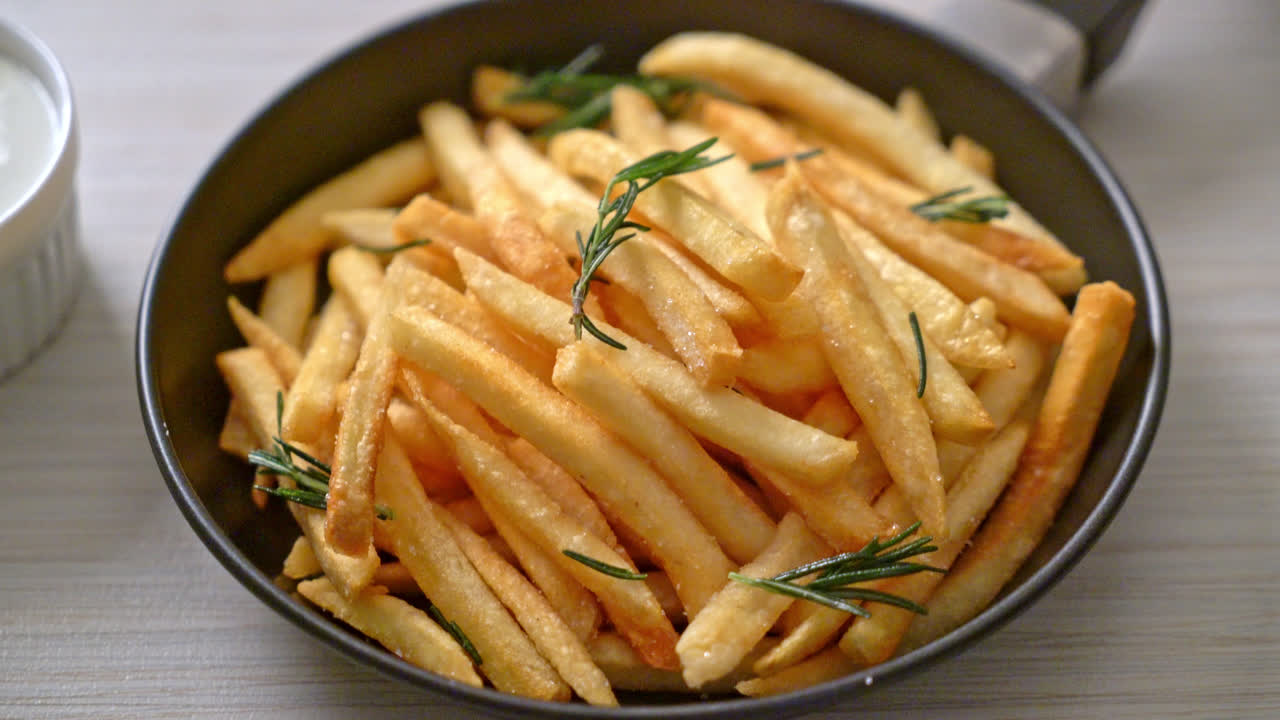 French fries or potato chips with sour cream and ketchup