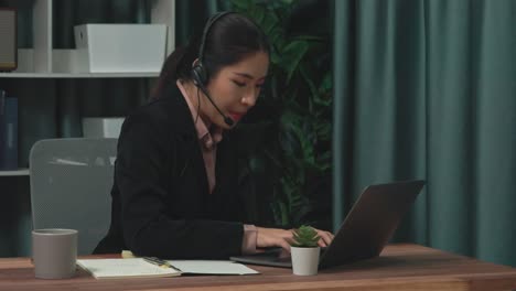 enthusiastic businesswoman utilizing laptop for video conference.