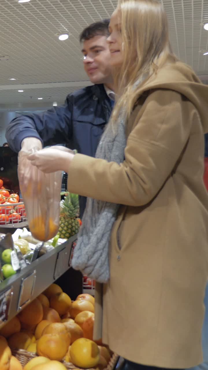Couple shopping for fruits at the supermarket