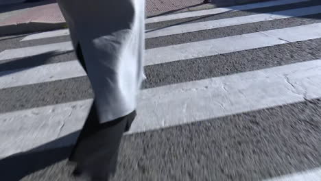 person walking across a crosswalk