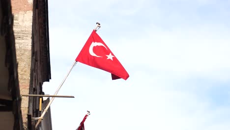 turkish flag waving on a building