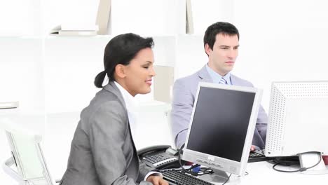 businesswoman working in an office with her colleagues