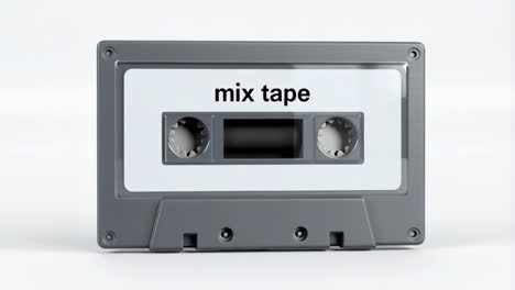 a grey audio cassette tape labeled 'mix tape'