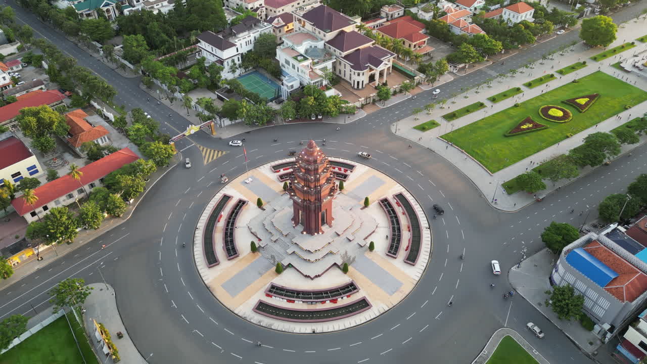 Aerial shot looking down at Phnom Penh’s Independence Monument, neatly framed by roads and gardens