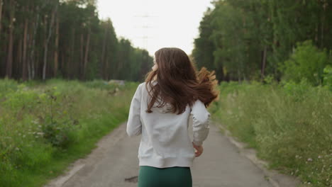 woman running on a forest path