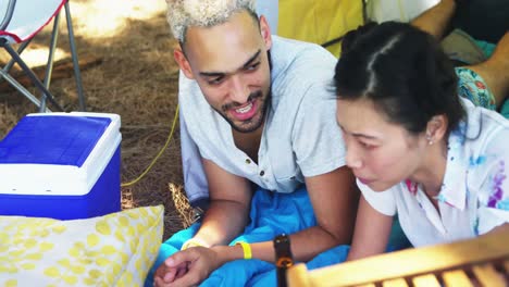 Couple-lying-on-tent-at-music-at-music-festival-4k