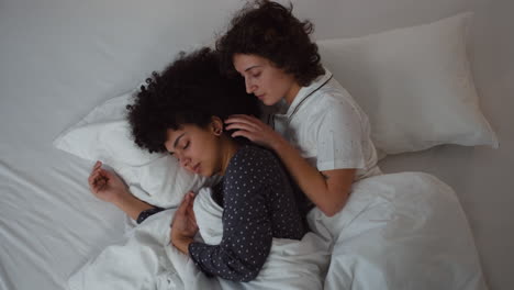 happy couple laying on bed