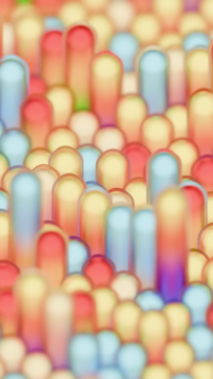 Eng med pastelfarvede søjler, blødt fokus drømmeagtig makroscene af slikfarvede cylindre og runde perler der stiger op