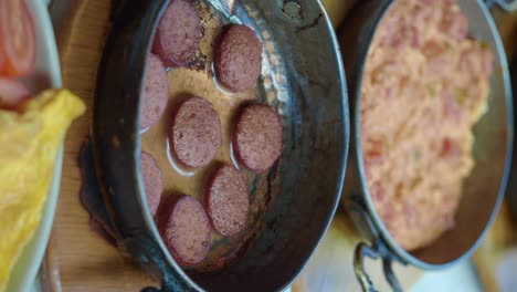 turkish breakfast with sausages and eggs
