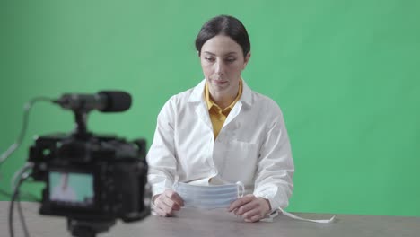 female doctor explaining how to use a surgical mask