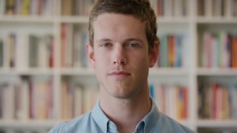 portrait attractive young man turns head looking confident successful male entrepreneur in library bookshelf background