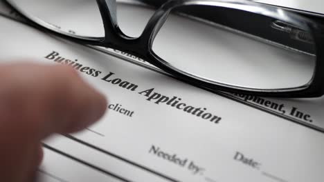 finger tapping on business loan application