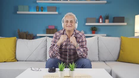 happy man listening to music with headphones.