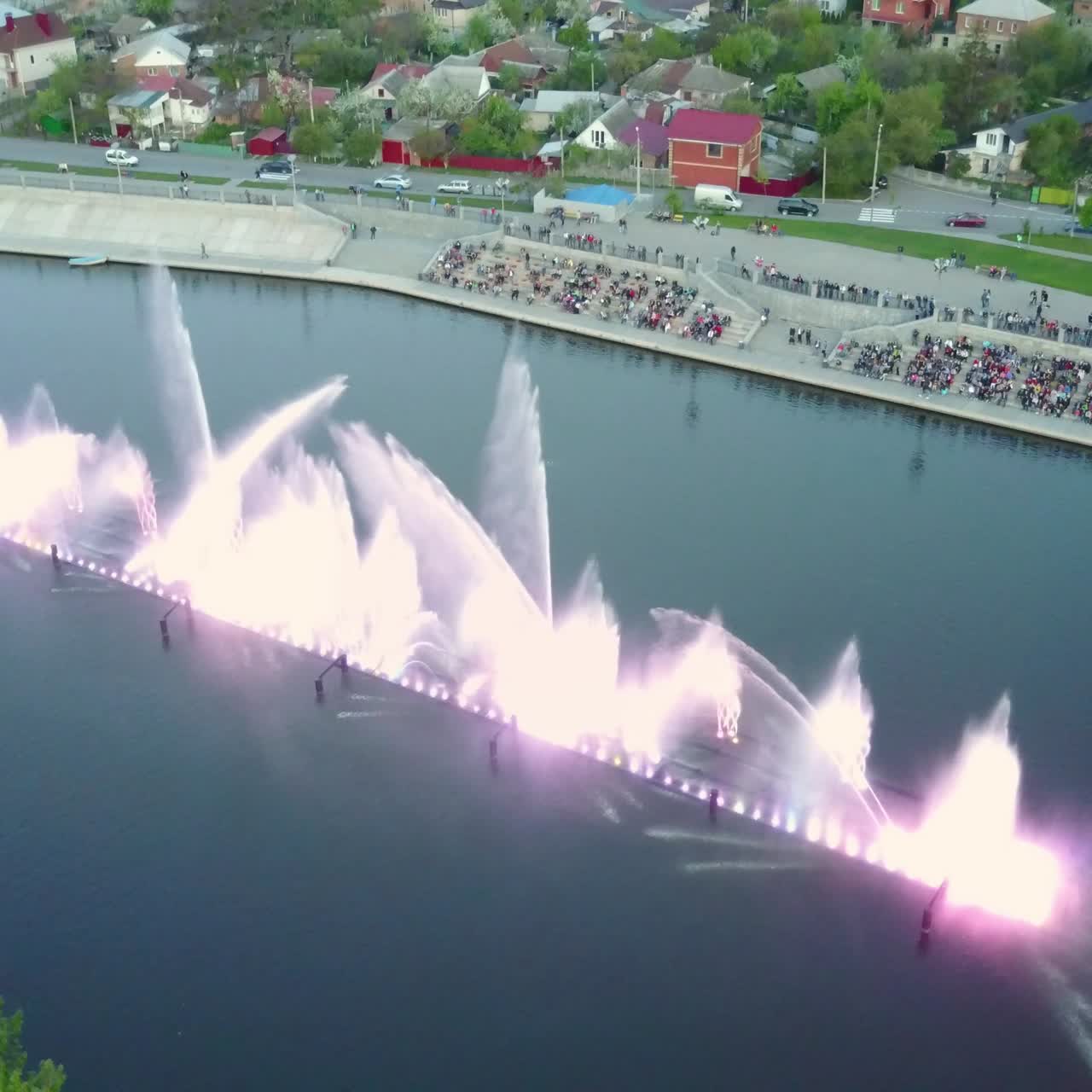 Musical Fountain Show. Aerial shot of the beautiful fountain show with reflection on water