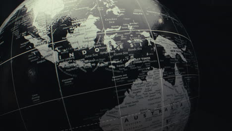 close-up of a black and white world globe