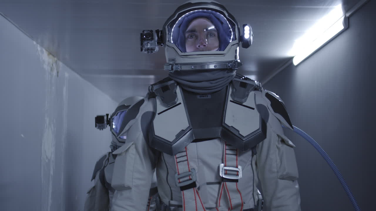 Astronauts in a spaceship corridor
