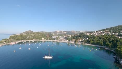 aerial drone footage of the crystal blue water in the bay of mlini beach, croatia