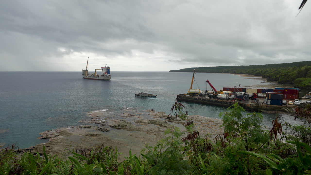 A shipping container offloading supplies at the port of Niue in the South Pacific