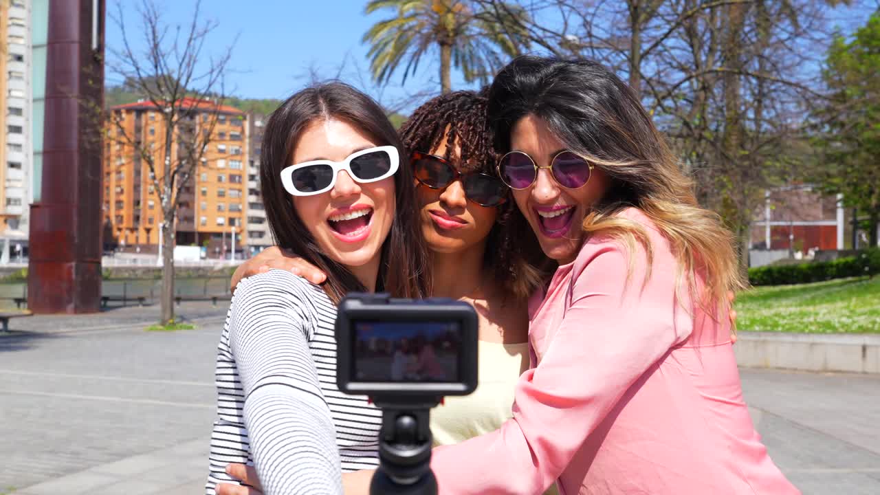 Three women taking selfie outdoors