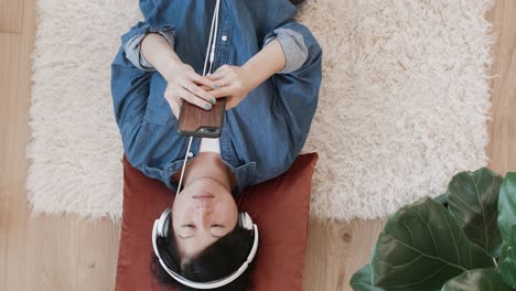 woman listening to music at home