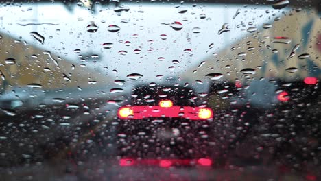 Heavy-rain-in-the-UAE:-A-view-from-the-car-dashcam-capturing-rainfall-in-Dubai,-United-Arab-Emirates