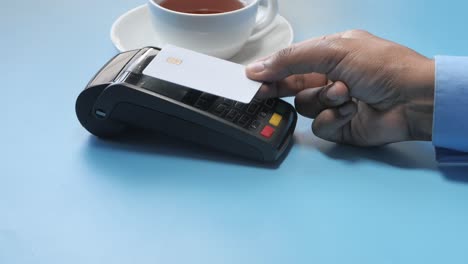 contactless credit card payment at a cafe