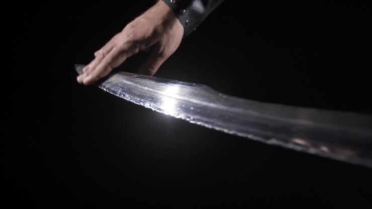 Historical war sword. Black background.
