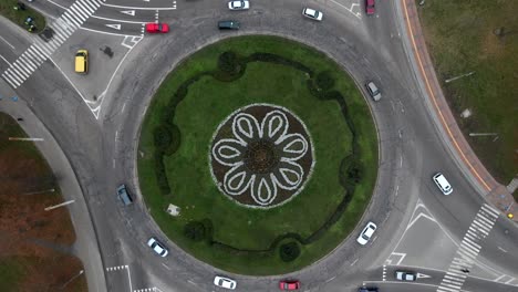 4k aerial view timelapse of roundabout road with circular cars.