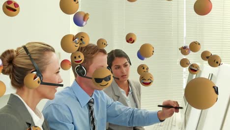 animation of emoji falling over business people wearing phone headsets