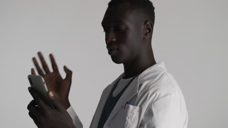 african american doctor on grey background.