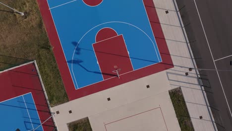 drone rise up above sports courts in my neighbourhood