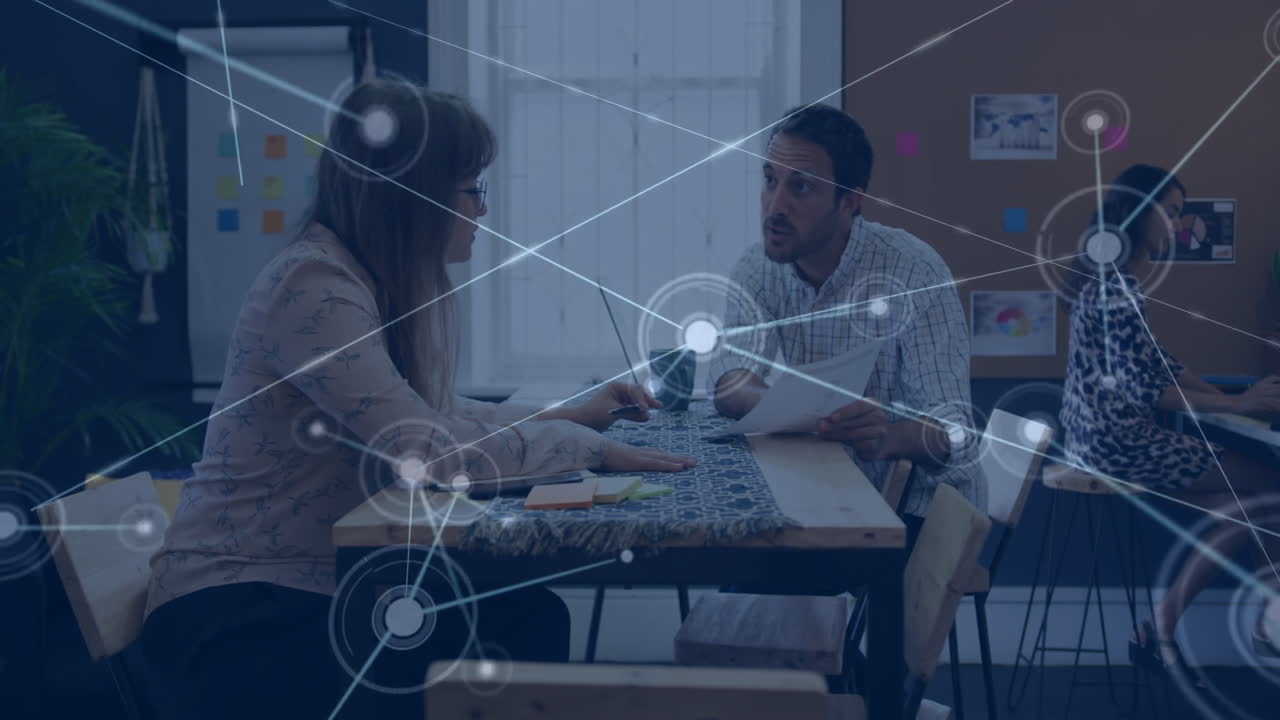 Animation of network of connections over diverse business people in office