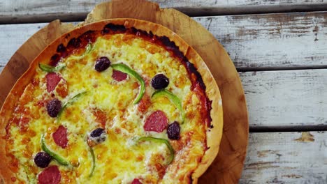 baked pizza on wooden board