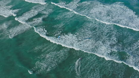 kiteboarding on turquoise waves