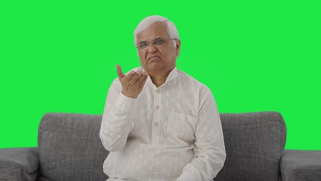 Upset-Indian-old-man-slapping-his-head-Green-screen